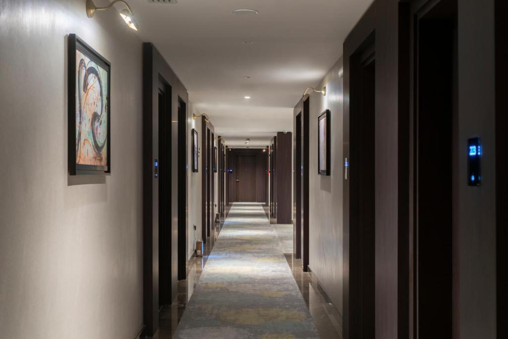 a hallway of a building with a long corridor at Gardino Hotel & Residence in Riyadh