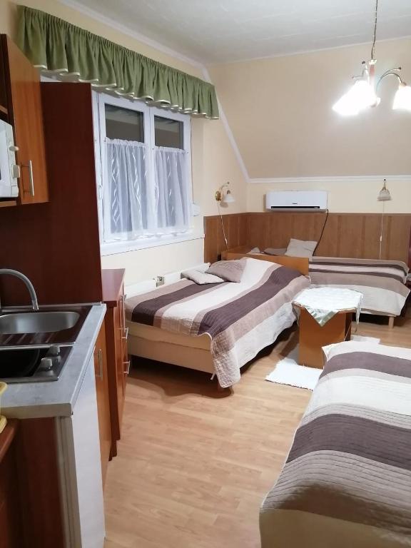 Posteľ alebo postele v izbe v ubytovaní Molnár Apartment