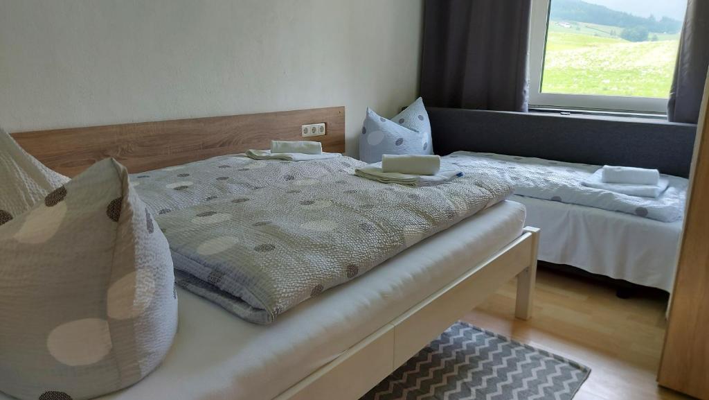 Postel nebo postele na pokoji v ubytování Pension Rauschberghof