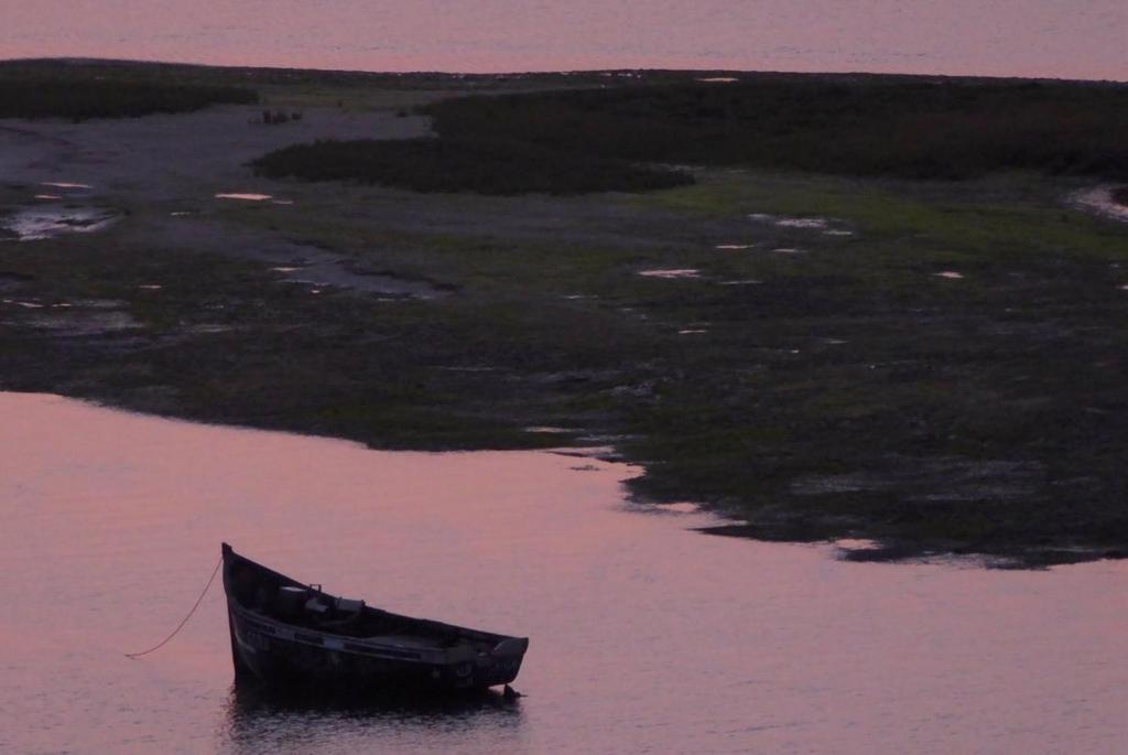 a boat sitting in a body of water at Le temps perdu in Oualidia