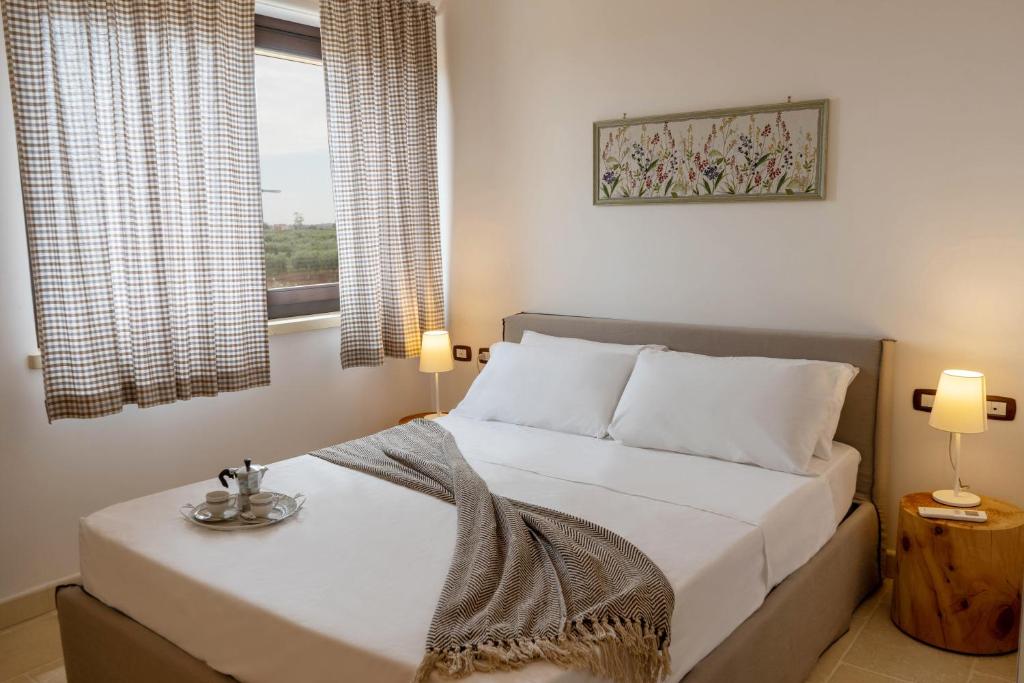 Postel nebo postele na pokoji v ubytování TERRA TERRA - Masseria Minunni