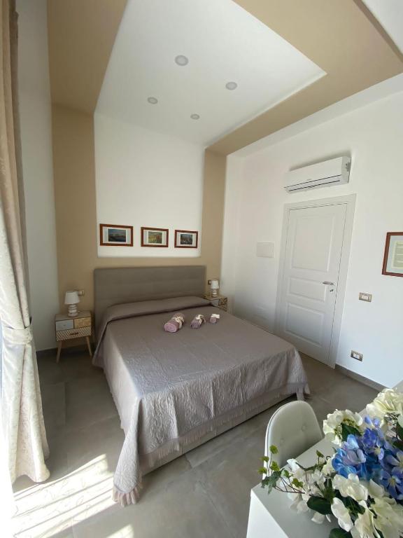 Postel nebo postele na pokoji v ubytování B&B 80056 Ercolano