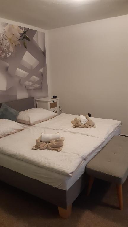 Postel nebo postele na pokoji v ubytování Budha Apartmá