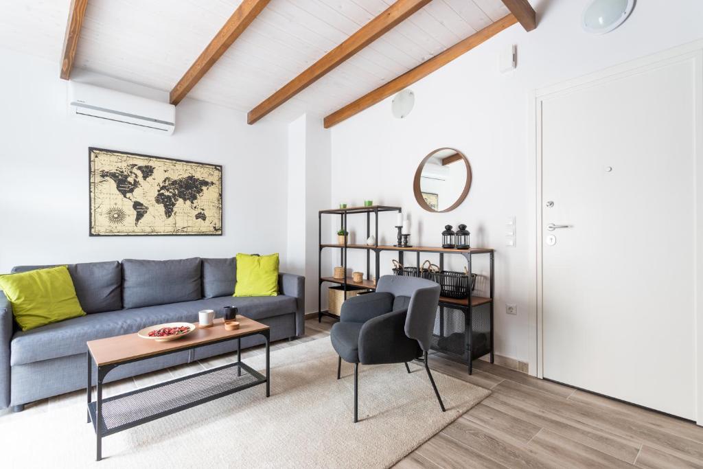 a living room with a couch and a table at modern city center loft in Ioannina