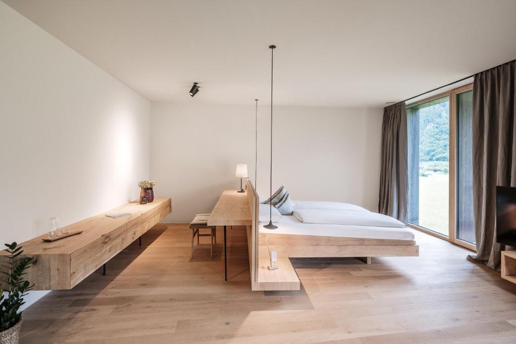 A bed or beds in a room at zelloon boutique hotel