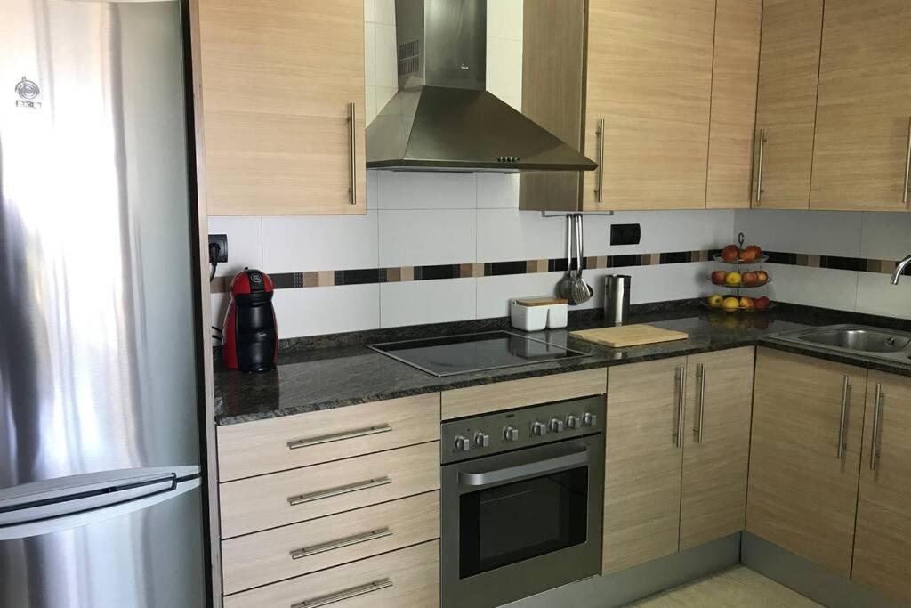 Kuchyň nebo kuchyňský kout v ubytování Precioso ático en complejo residencial con piscina