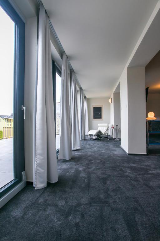 Postel nebo postele na pokoji v ubytování Hotel & Gallery Kopacka