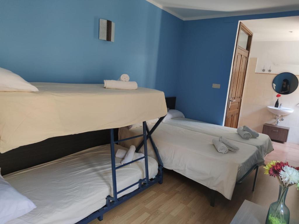 Postel nebo postele na pokoji v ubytování Albergue rural l'Almada de Yebra