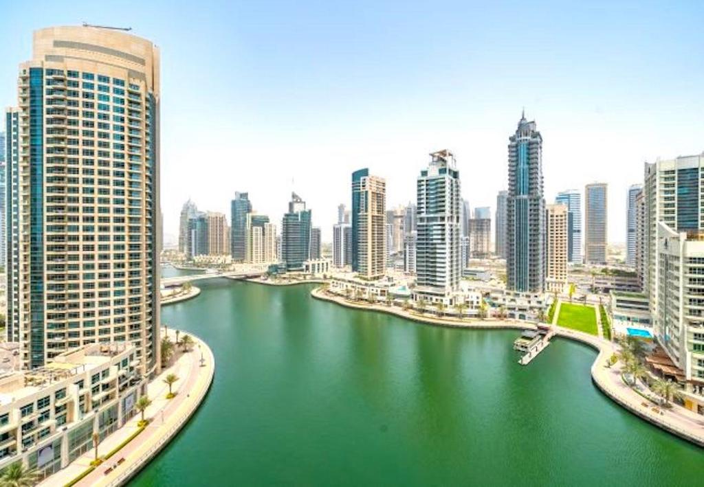 a view of a river in a city with buildings at Dubai Marina View Luxury LIV Residence Apartment 2 Bedrooms 3 Bathrooms in Dubai