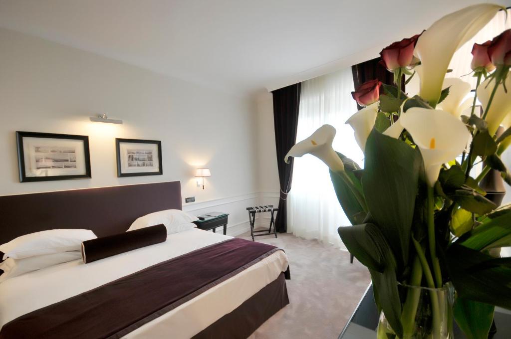 Łóżko lub łóżka w pokoju w obiekcie Grand Hotel Oriente