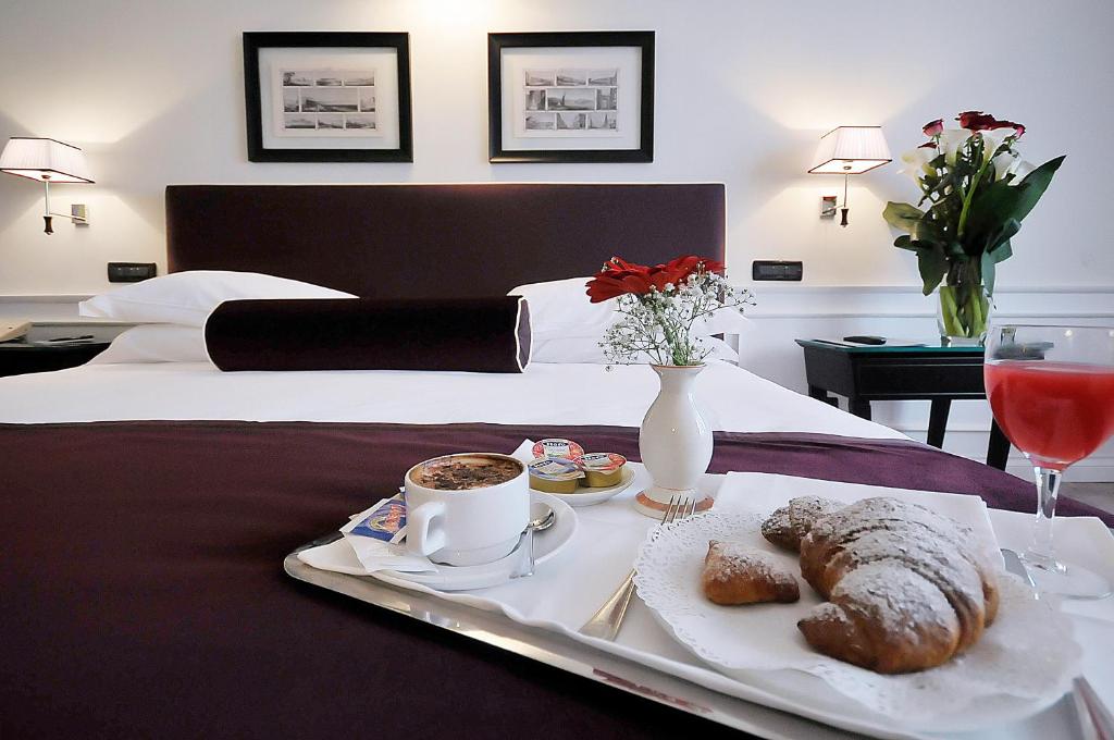 Łóżko lub łóżka w pokoju w obiekcie Grand Hotel Oriente