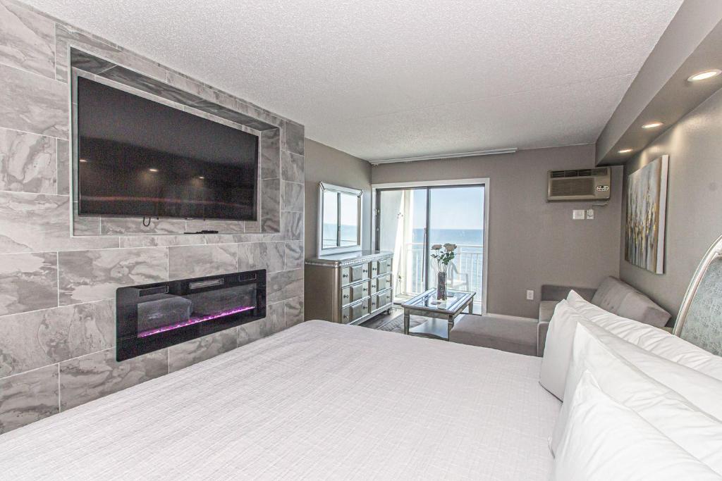 Voodi või voodid majutusasutuse Luxury Oceanfront Studio Sea Mist Resort 20907 King Suite 9th Floor toas