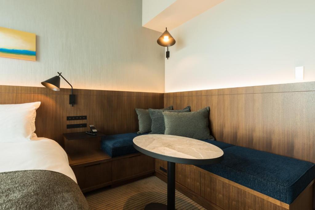 Postel nebo postele na pokoji v ubytování Hotel Metropolitan Kawasaki
