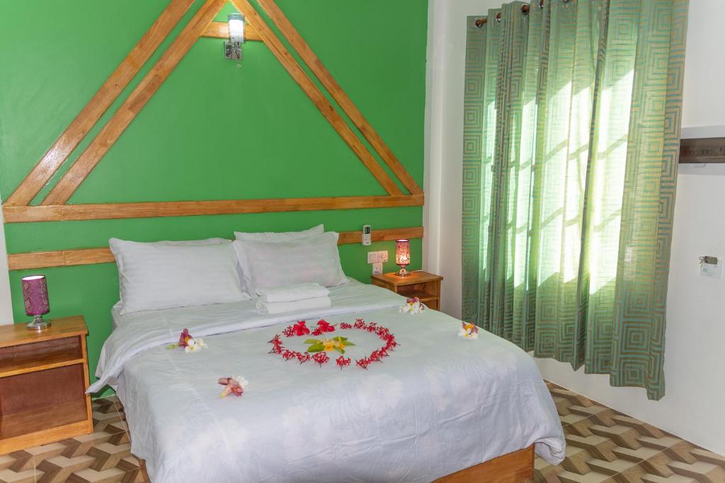 Postel nebo postele na pokoji v ubytování Chao Guest House