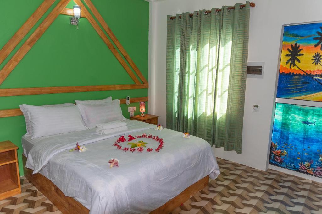 Postel nebo postele na pokoji v ubytování Chao Guest House