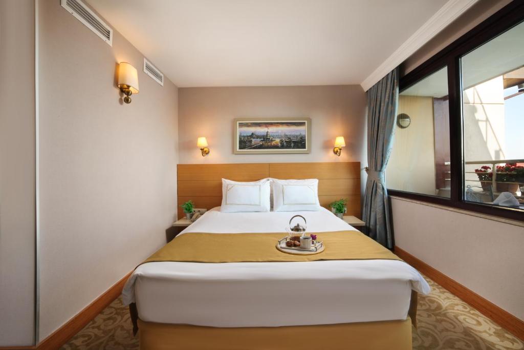 Postel nebo postele na pokoji v ubytování Almina Hotel - Special Class