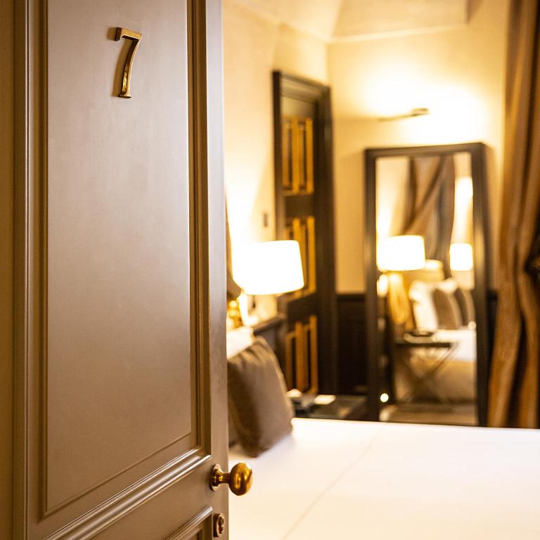 Postel nebo postele na pokoji v ubytování Palazzo Righini