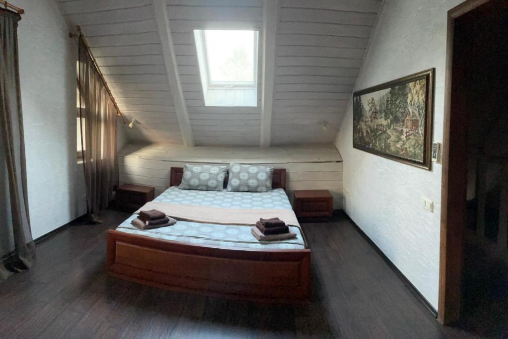 Ένα ή περισσότερα κρεβάτια σε δωμάτιο στο Guest House on Lesnaya