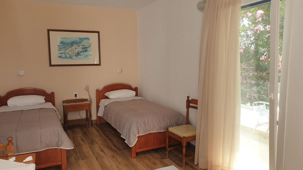 Postel nebo postele na pokoji v ubytování Miros Hotel Apartments