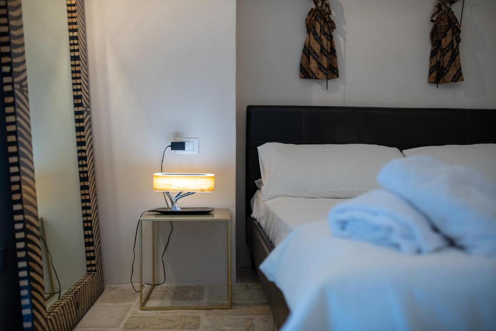 Postel nebo postele na pokoji v ubytování B&B Trulli Moonlight da Grace