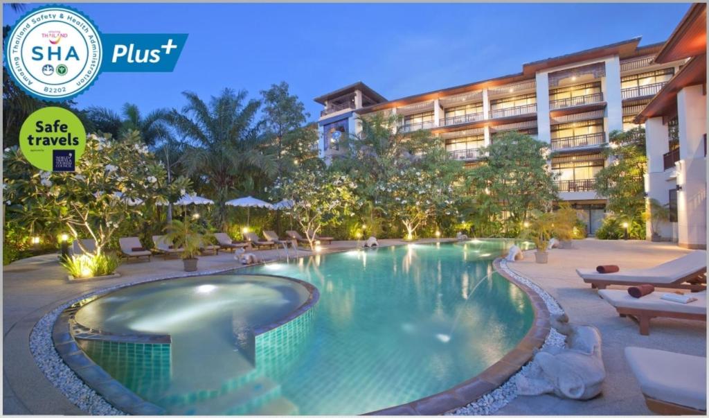 a swimming pool in front of a hotel at Le Murraya Boutique Serviced Residence & Resort in Chaweng