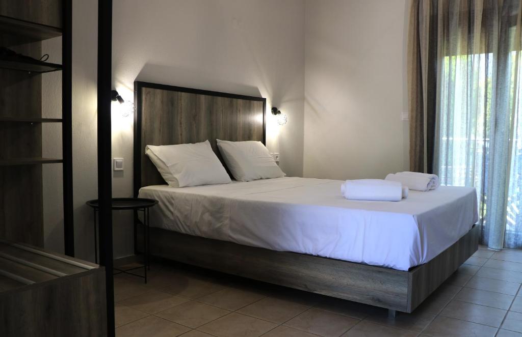 Posteľ alebo postele v izbe v ubytovaní Aliston Hotel Thassos
