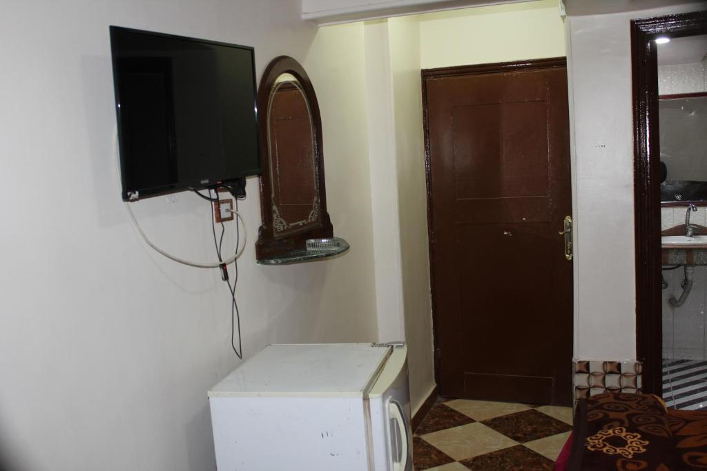 TV a/nebo společenská místnost v ubytování Tiba Hotel