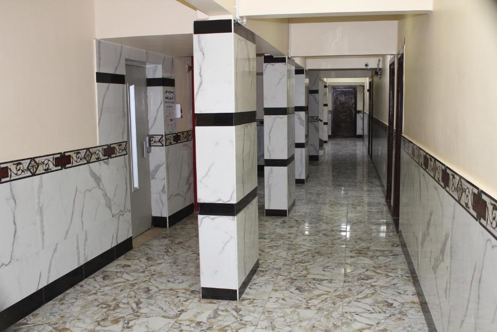 Kuchyň nebo kuchyňský kout v ubytování Tiba Hotel