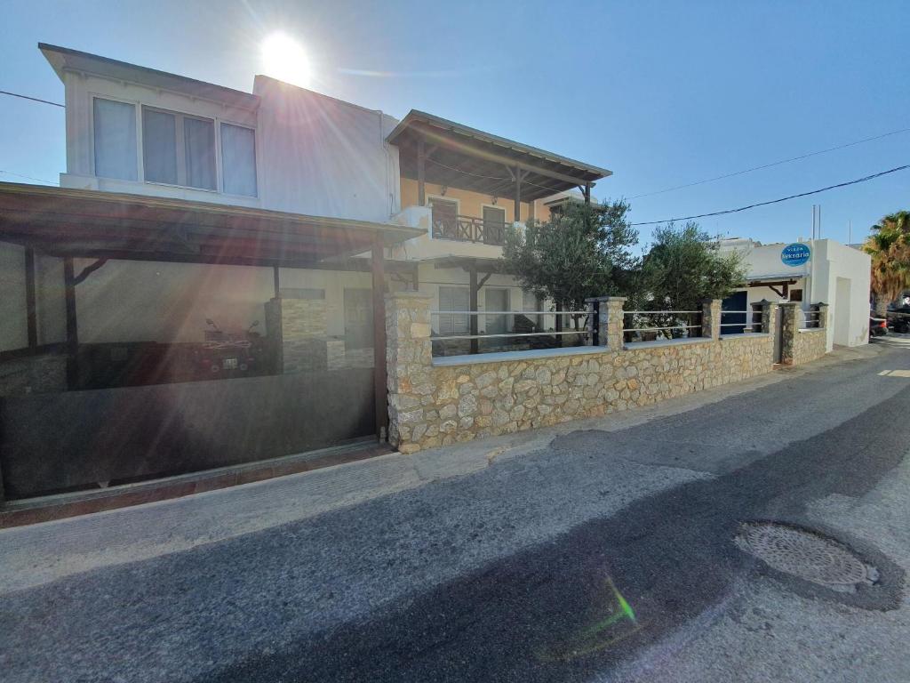 a house on the side of a street at Villa Nektaria in Perissa