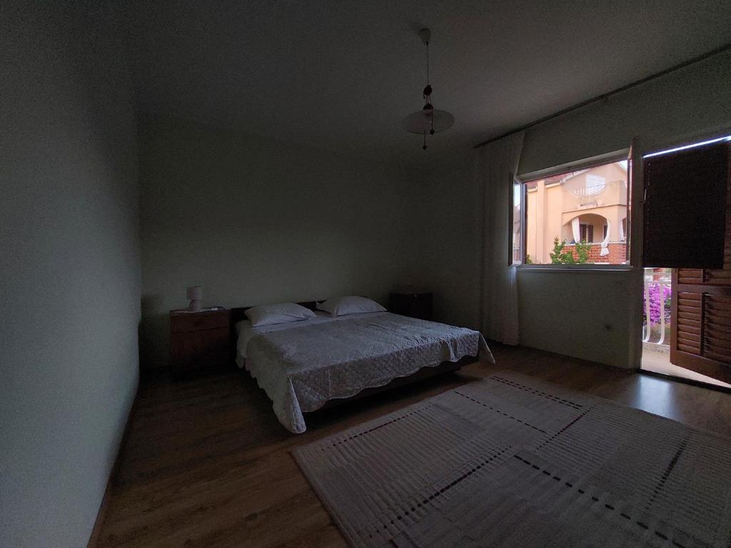 Postel nebo postele na pokoji v ubytování Apartman Stipe