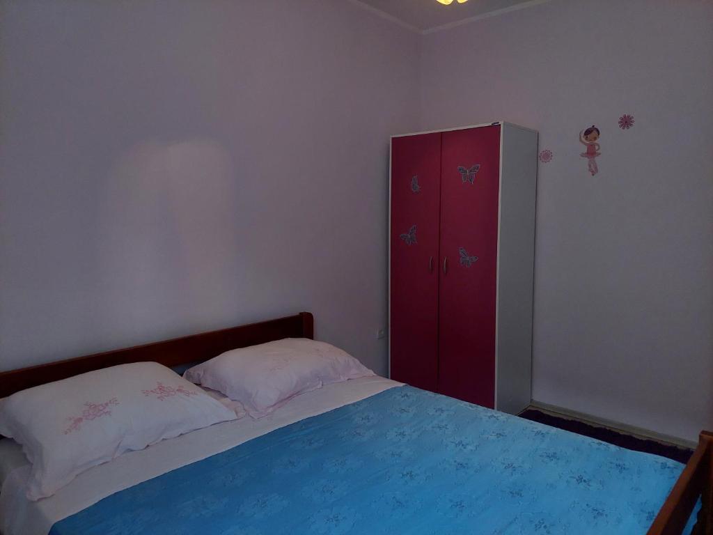 Postel nebo postele na pokoji v ubytování Apartman Stipe