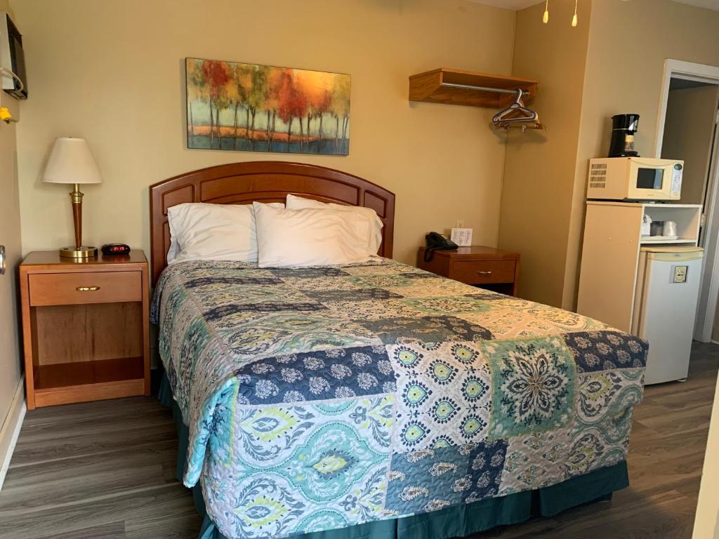 Postel nebo postele na pokoji v ubytování Dunlop Motel