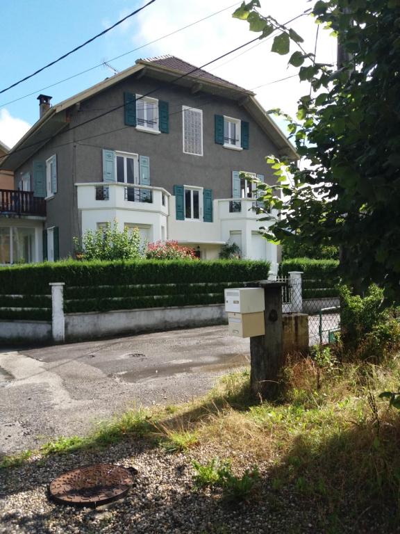 a house with a box in front of it at Au bord du Foron in Scionzier