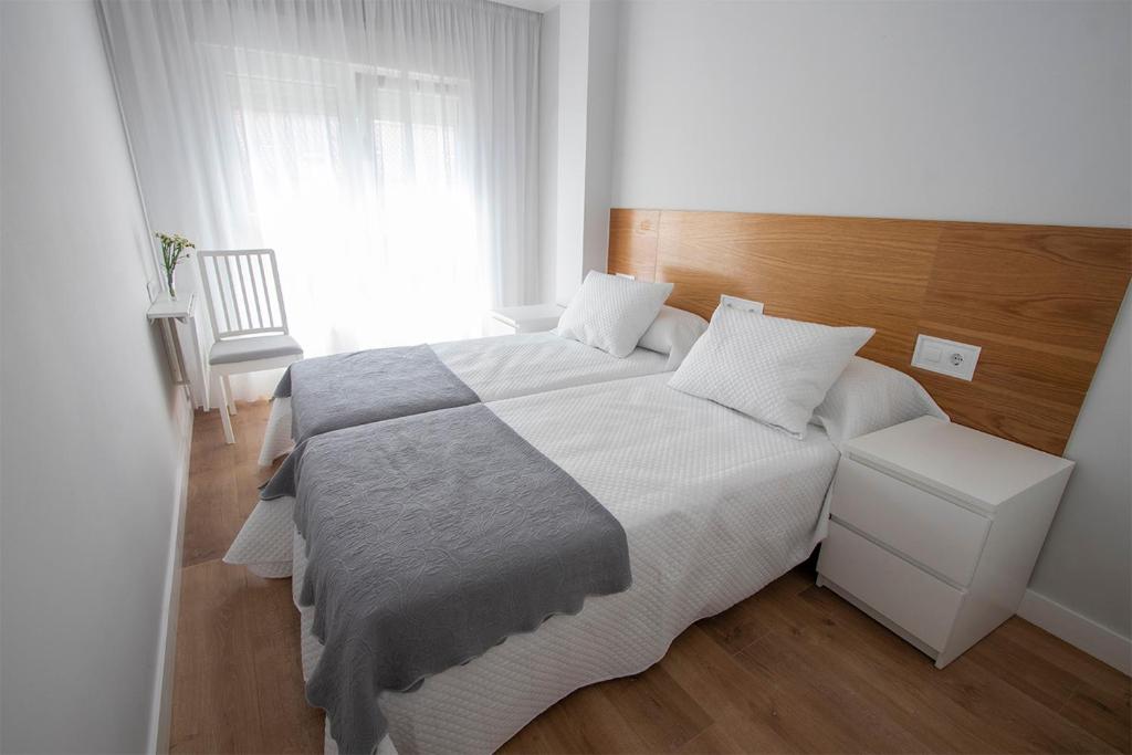 Łóżko lub łóżka w pokoju w obiekcie Precioso apartamento en Marín.