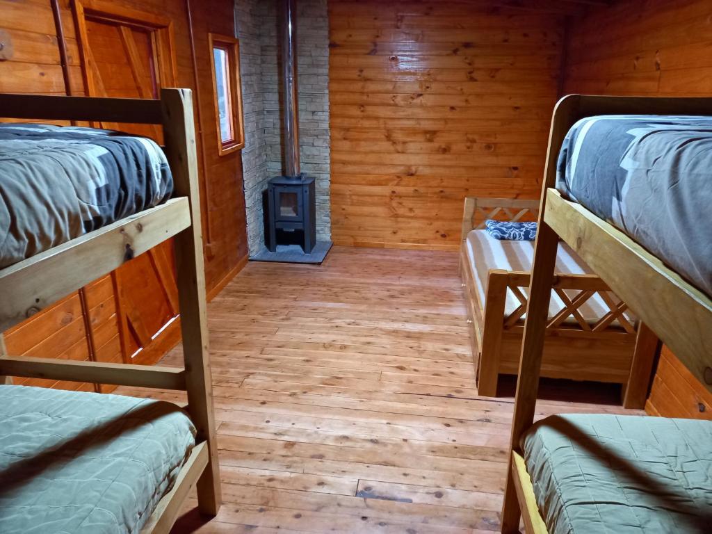 Postel nebo postele na pokoji v ubytování Refugio Ventana
