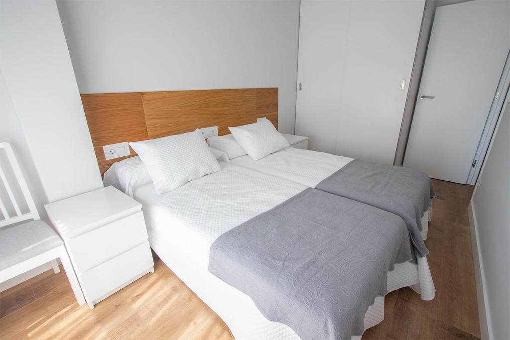 Łóżko lub łóżka w pokoju w obiekcie Precioso apartamento en Marín.