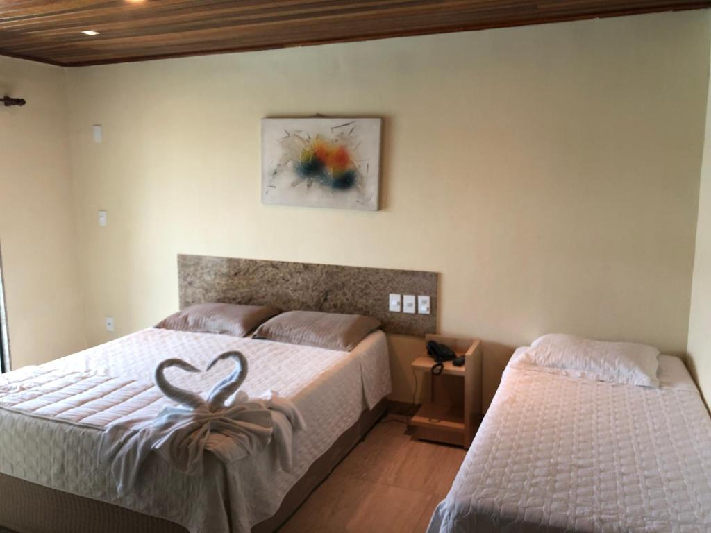 Postel nebo postele na pokoji v ubytování Porto Bali Hotel
