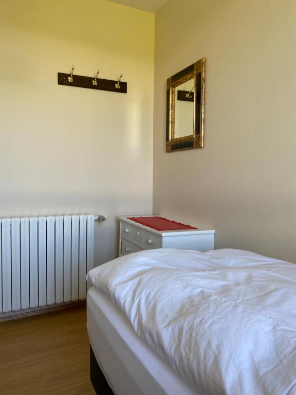 Postel nebo postele na pokoji v ubytování Syðstibær Guesthouse