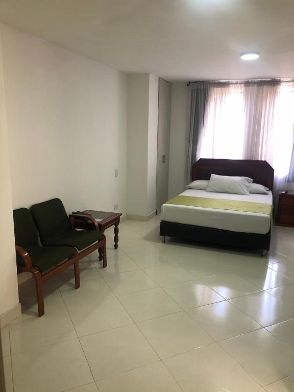 Postel nebo postele na pokoji v ubytování Hotel Florida Inn