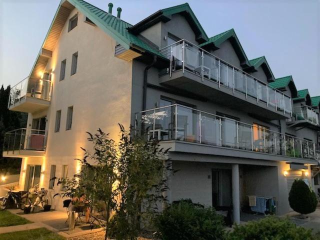 a large white building with a large balcony at Zielony Daszek in Sianozety