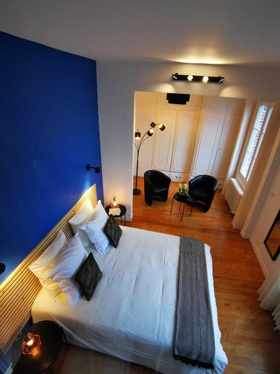 Postel nebo postele na pokoji v ubytování Chez Hortense