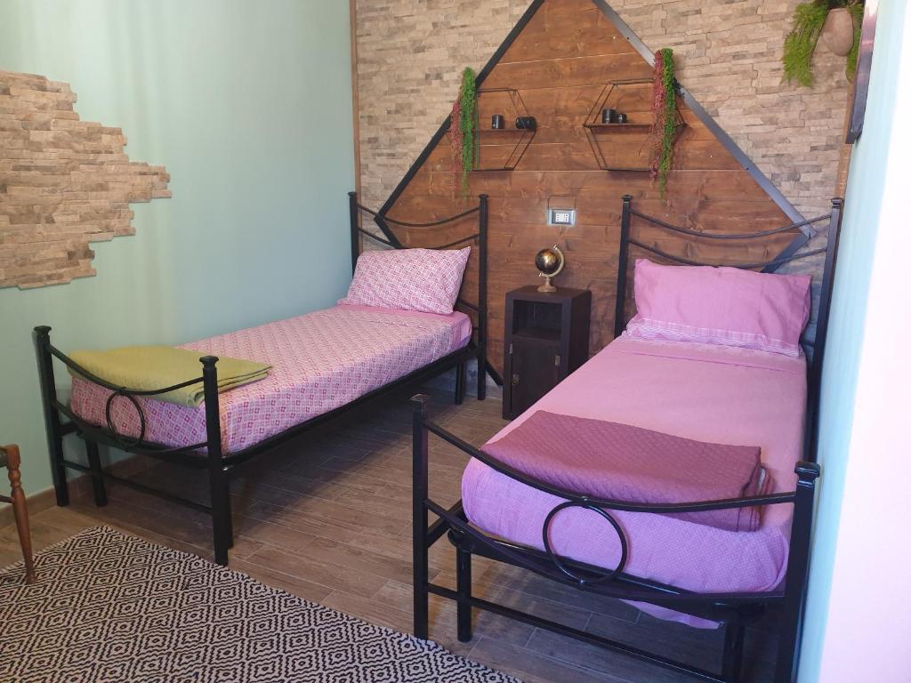 Postel nebo postele na pokoji v ubytování Stanza Del Viggiatore