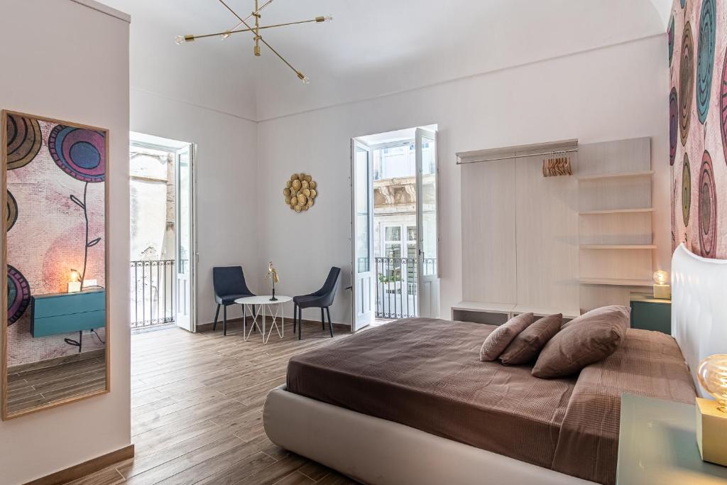 Posteľ alebo postele v izbe v ubytovaní FLOWER SUITE B&B
