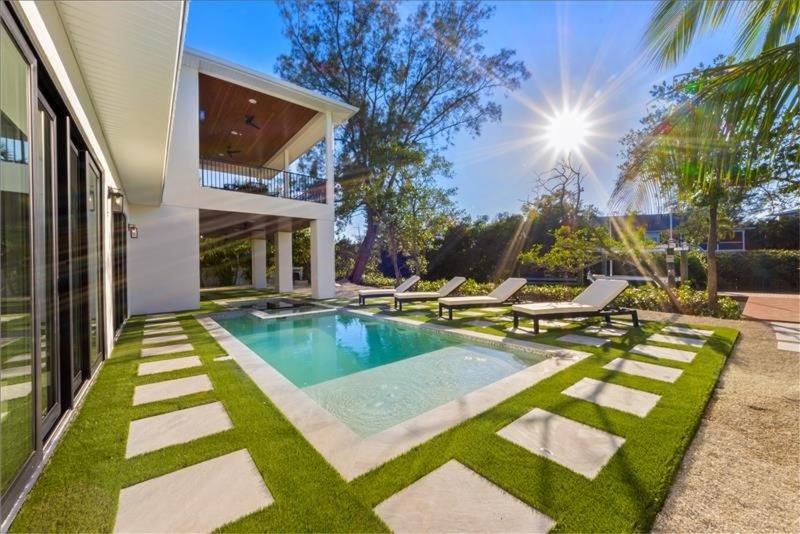 a swimming pool in the backyard of a house at Our Great Escape home in Anna Maria