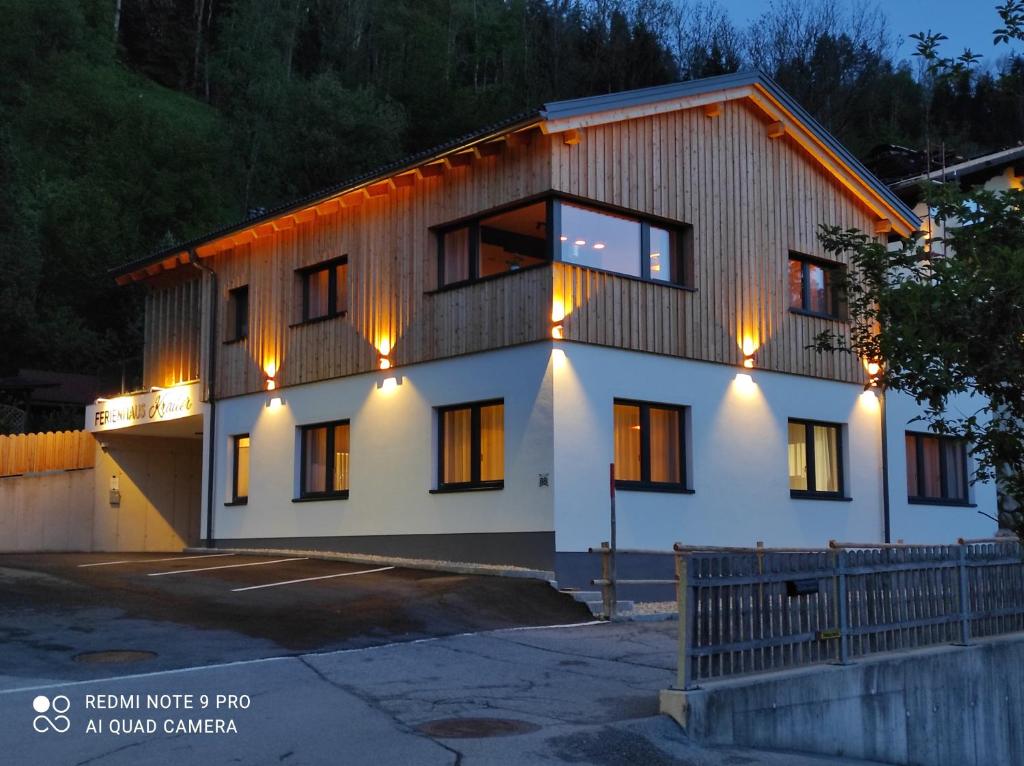 a house with lights on the side of it at Ferienhaus Kraiter in Schladming