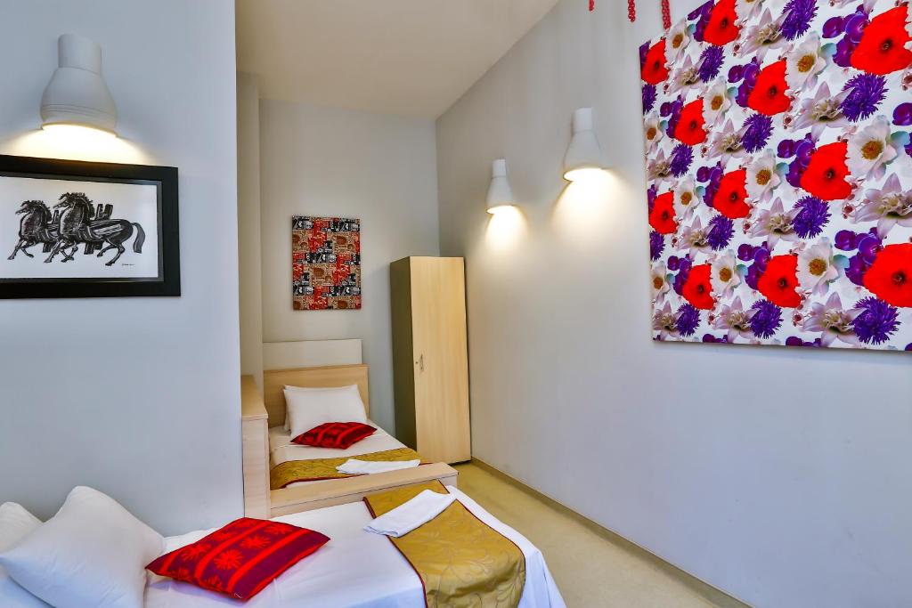 Postel nebo postele na pokoji v ubytování Han Hotel