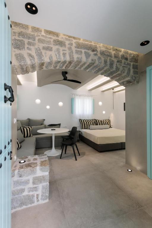 Postel nebo postele na pokoji v ubytování Majo Suites Hotel