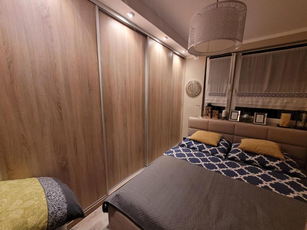 Posteľ alebo postele v izbe v ubytovaní Shutter Apartment