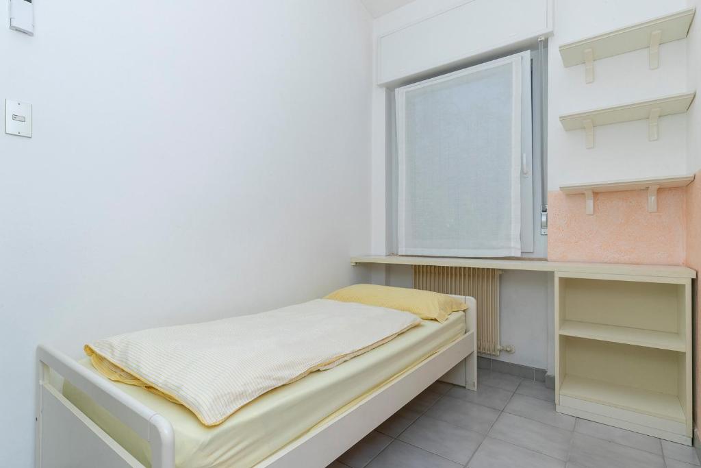 Łóżko lub łóżka w pokoju w obiekcie Apartament Kormorano