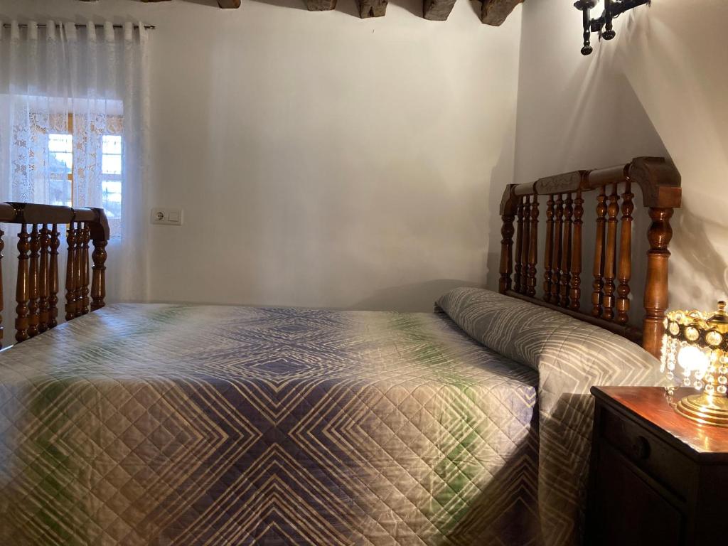 A bed or beds in a room at La Casa de la Abuela